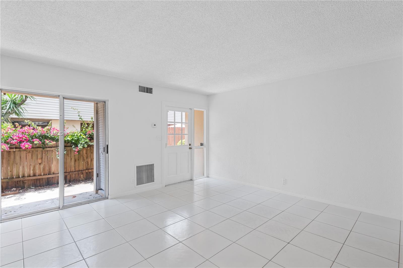 6603 Winfield Boulevard, Unit B2 Margate, FL 33063 - Photo 14 of 28 a view of an empty room and a window