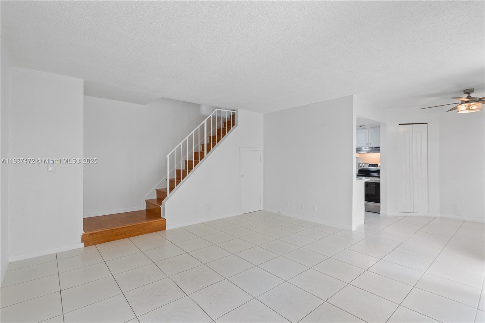 6603 Winfield Boulevard, Unit B2 Margate, FL 33063 - Photo 16 of 28 a view of an empty room with stairs