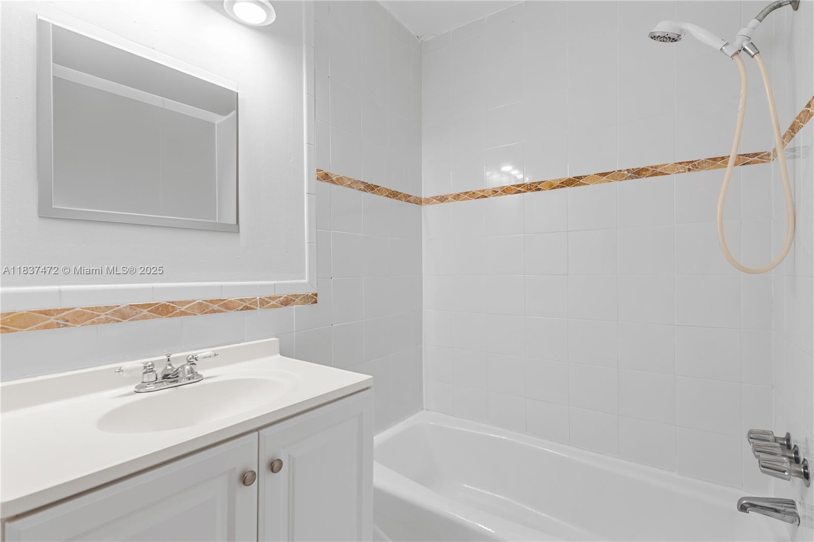 6603 Winfield Boulevard, Unit B2 Margate, FL 33063 - Photo 17 of 28 a bathroom with a sink and a bathtub