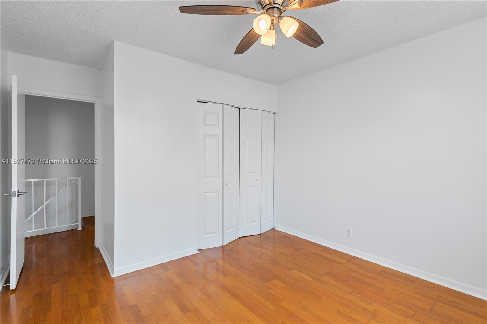 6603 Winfield Boulevard, Unit B2 Margate, FL 33063 - Photo 19 of 28 a view of empty room with wooden floor