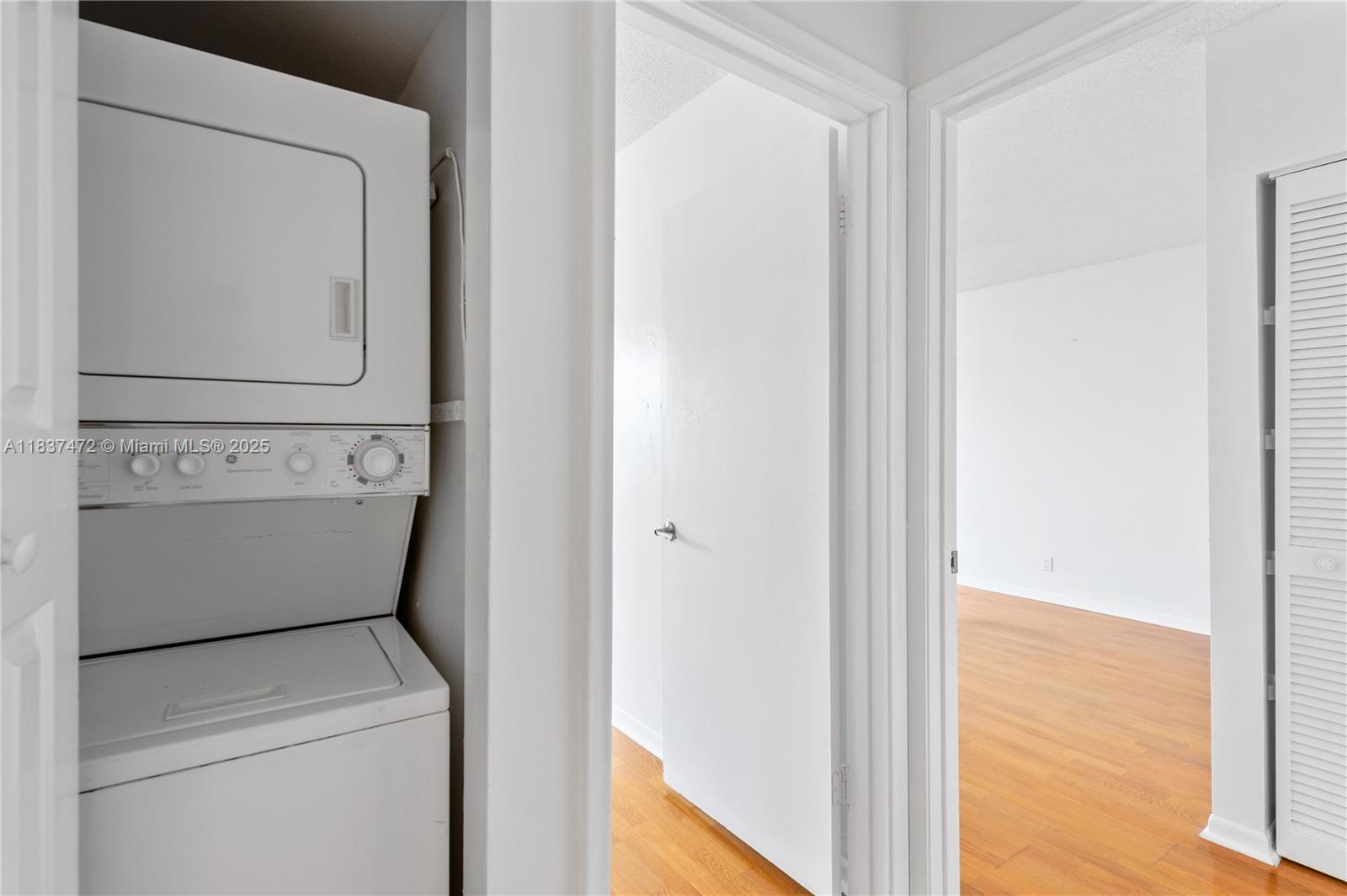 6603 Winfield Boulevard, Unit B2 Margate, FL 33063 - Photo 26 of 28 a utility room with dryer and washer