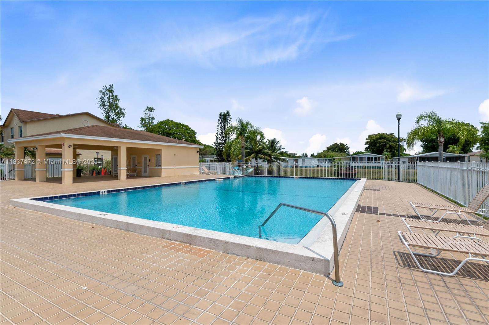 6603 Winfield Boulevard, Unit B2 Margate, FL 33063 - Photo 28 of 28 a view of a house with pool and a yard