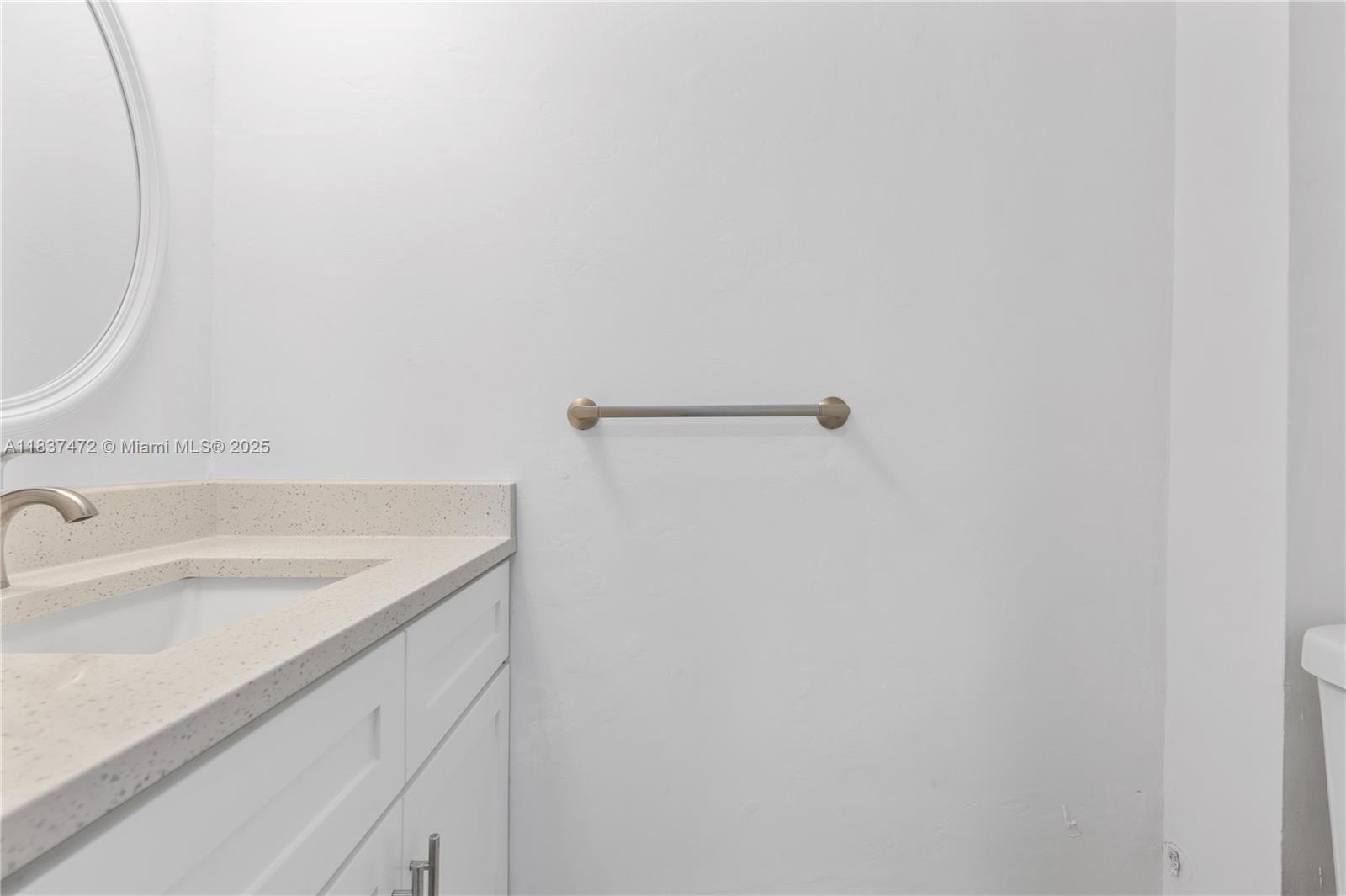 6603 Winfield Boulevard, Unit B2 Margate, FL 33063 - Photo 8 of 28 a bathroom with a sink and vanity