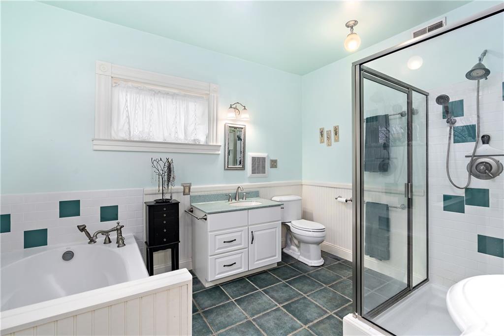 1000 River Road Beaver, PA 15009 - Photo 14 of 25 a bathroom with a double vanity sink toilet and shower