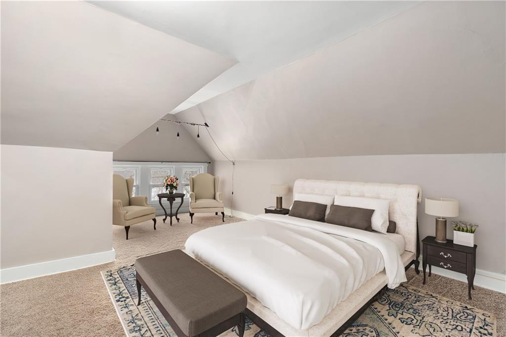 1000 River Road Beaver, PA 15009 - Photo 19 of 25 a bedroom with a bed a table and chair