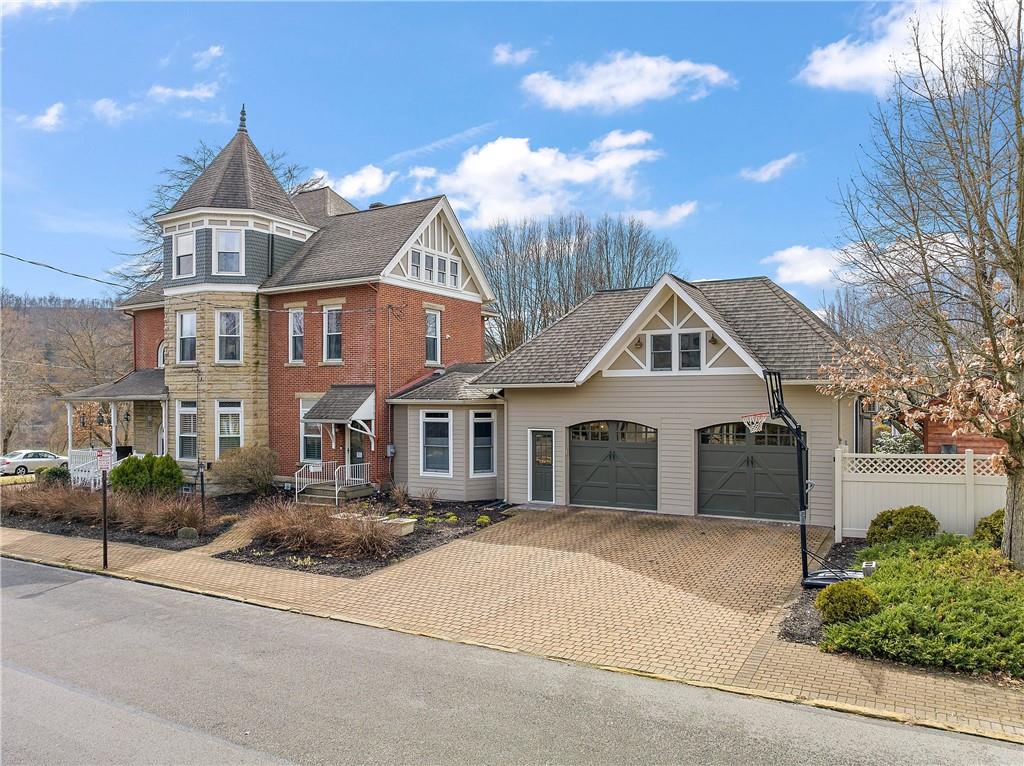 1000 River Road Beaver, PA 15009 - Photo 25 of 25 a front view of a house with a yard and garage