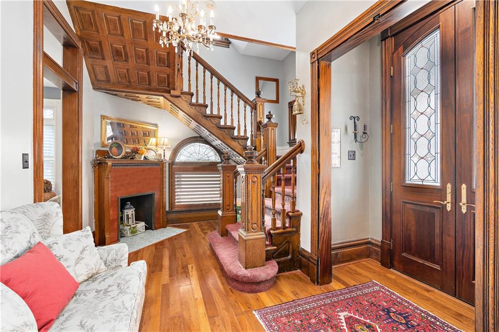 1000 River Road Beaver, PA 15009 - Photo 3 of 25 a bedroom with a bed and a chandelier