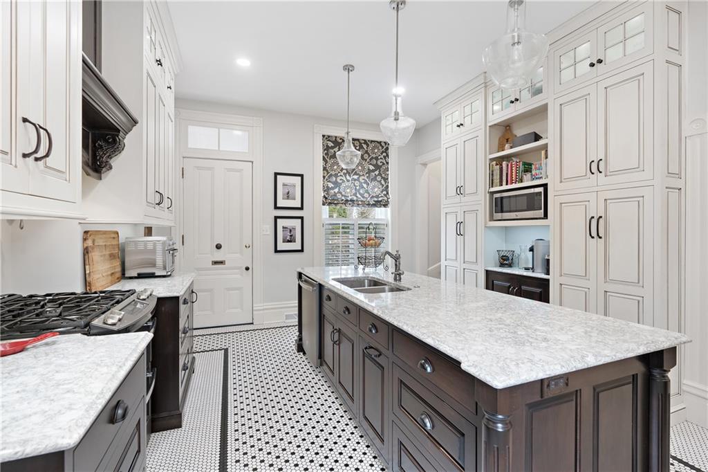 1000 River Road Beaver, PA 15009 - Photo 6 of 25 a kitchen with stainless steel appliances granite countertop a stove oven and a refrigerator