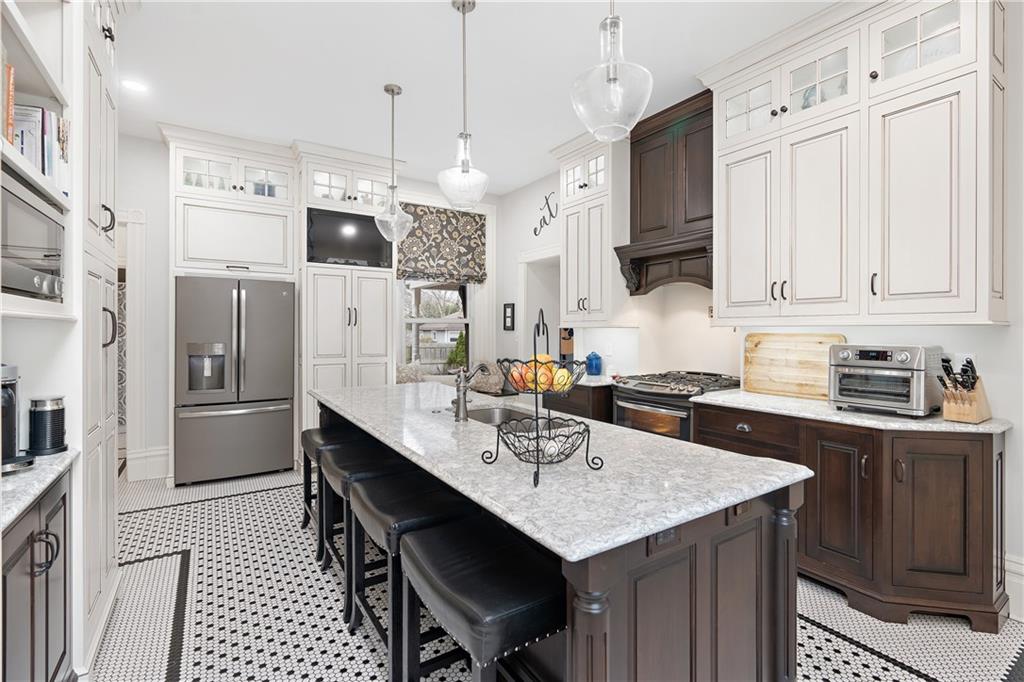 1000 River Road Beaver, PA 15009 - Photo 7 of 25 a kitchen with stainless steel appliances a sink a stove a refrigerator and cabinets