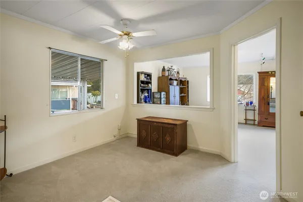 a kitchen with cabinets a sink and white appliances
