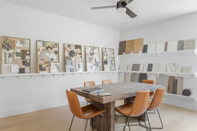 a view of a dining room with furniture and a chandelier