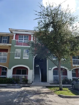 a front view of building with yard