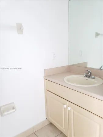 a bathroom with a sink and vanity
