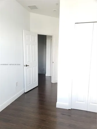 a view of a livingroom with wooden floor