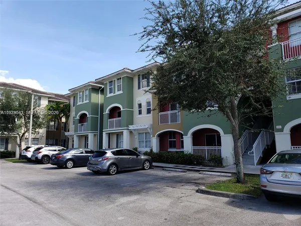 a view of a car park in front of house