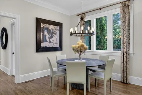 a spacious bedroom with a bed and a flat screen tv