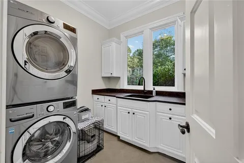 a bathroom with a tub a sink a mirror and a shower