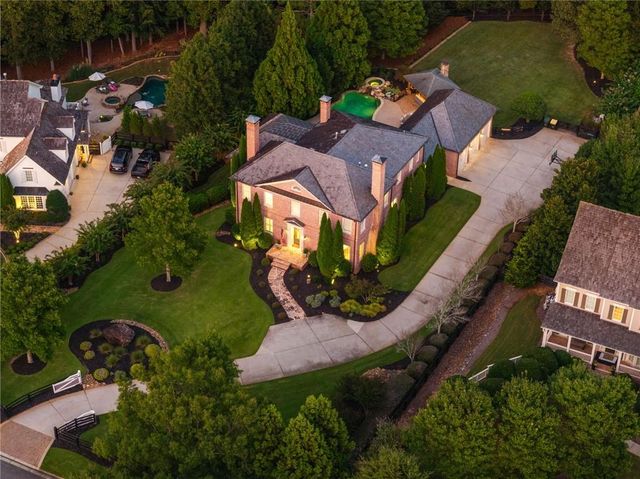 an aerial view of a house with garden space and street view