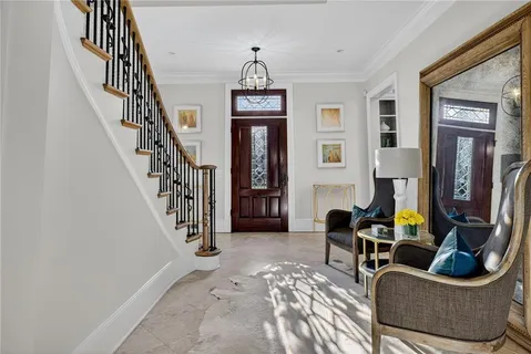 a bedroom with furniture and a window