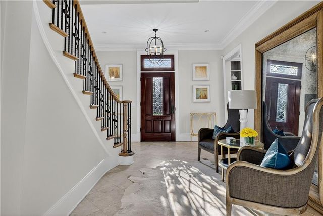 a bedroom with furniture and a window
