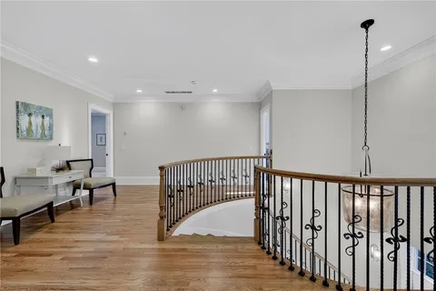 a en suite bathroom with a granite countertop sink and a mirror