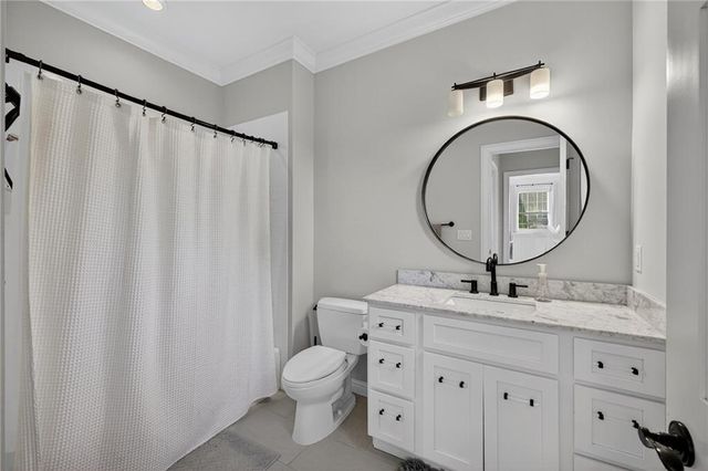 a view of room with flat screen tv and hallway