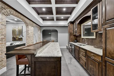 a view of a patio with a table and chairs under an umbrella