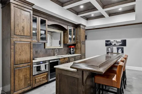 a view of a house with swimming pool and sitting area
