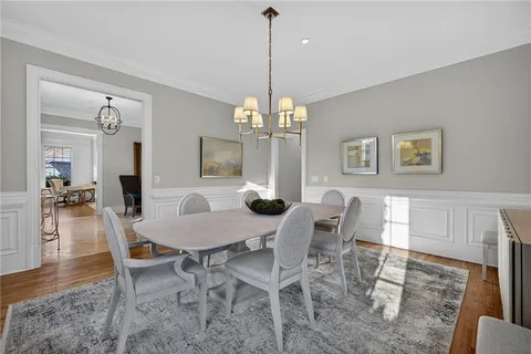 a living room with fireplace furniture and a flat screen tv