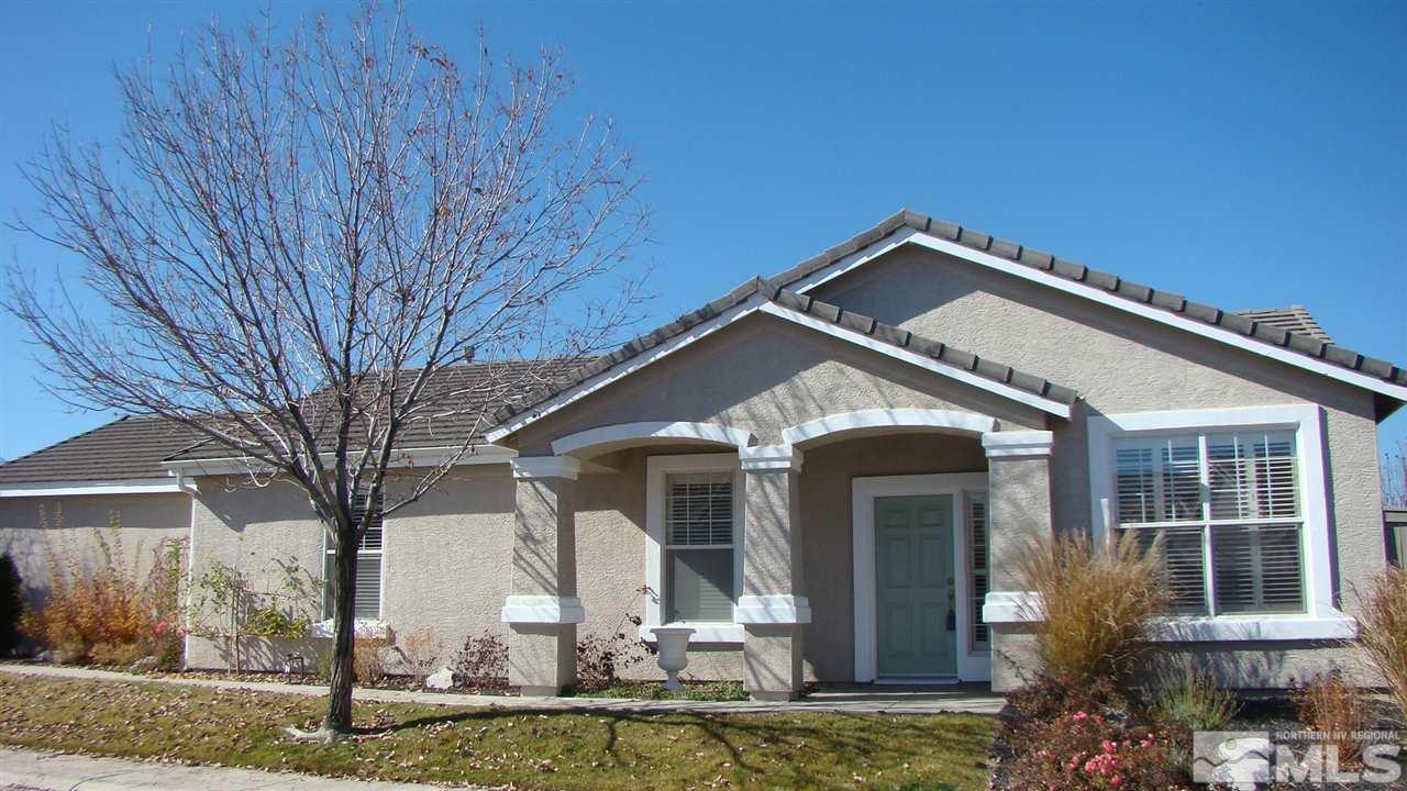 10447 Chadwell Drive Reno, NV 89521 - Photo 1 of 1 a front view of a house with garden