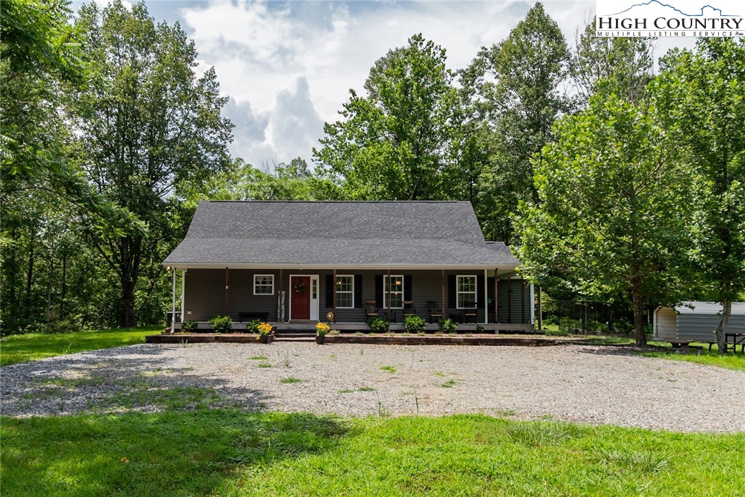 351 Colony Lane Purlear, NC 28665 - Photo 4 of 39 a front view of a house with a yard
