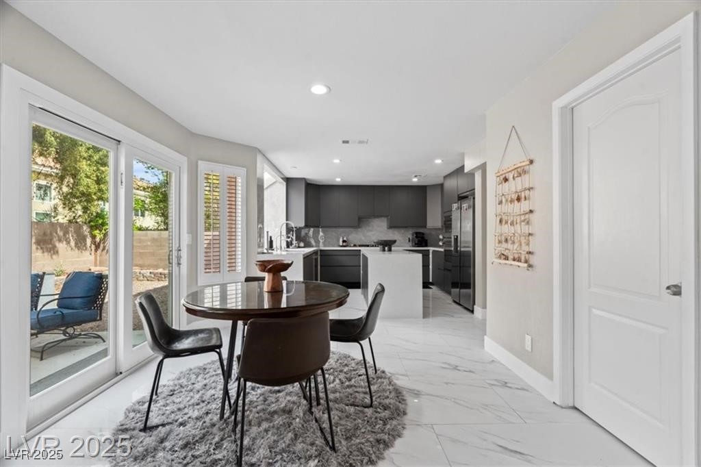9416 Rolling Ridge Lane Las Vegas, NV 89134 - Photo 16 of 34 Dining room featuring light marble finish flooring and recessed lighting