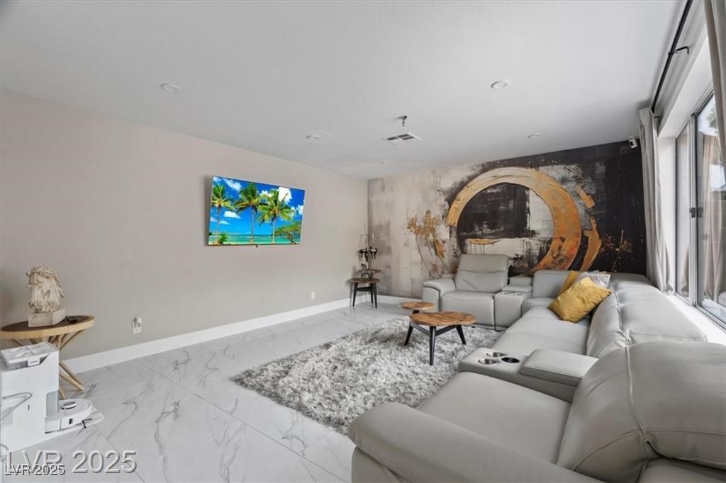 9416 Rolling Ridge Lane Las Vegas, NV 89134 - Photo 17 of 34 Living area featuring marble finish floors and baseboards