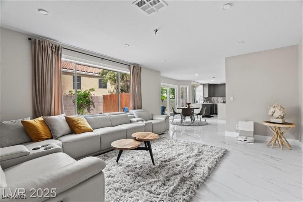 9416 Rolling Ridge Lane Las Vegas, NV 89134 - Photo 18 of 34 Living area featuring light marble finish flooring and recessed lighting