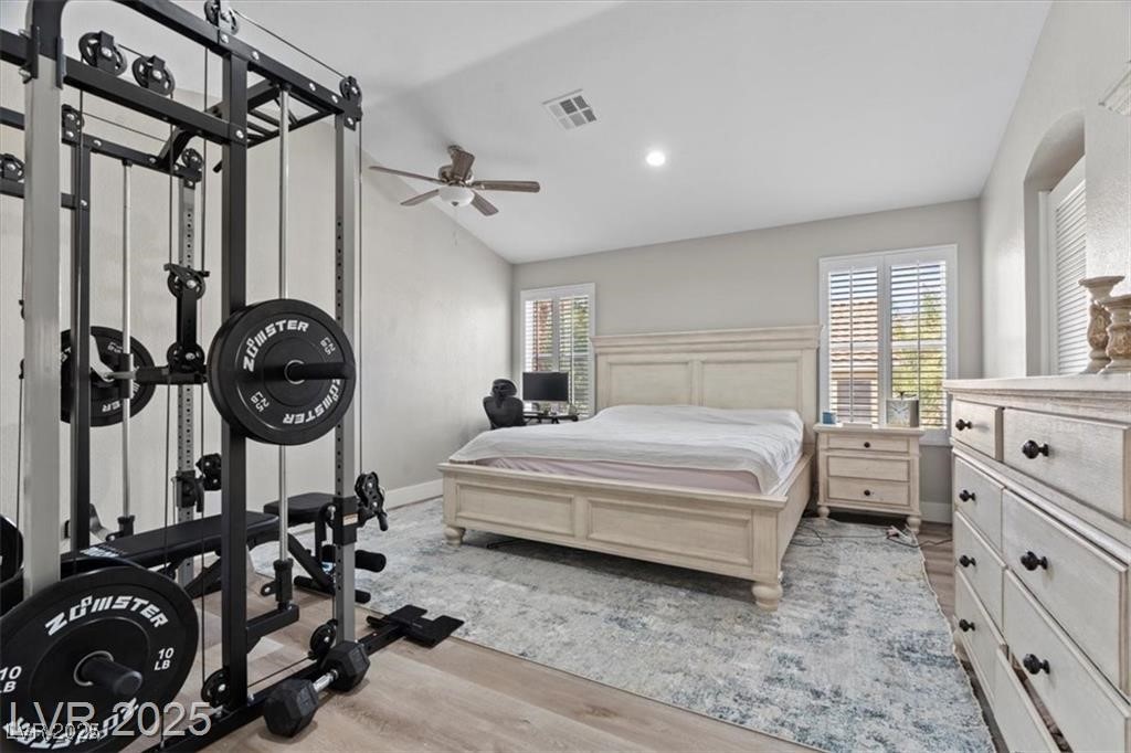 9416 Rolling Ridge Lane Las Vegas, NV 89134 - Photo 21 of 34 Bedroom featuring light wood-style floors, vaulted ceiling, recessed lighting, and a ceiling fan