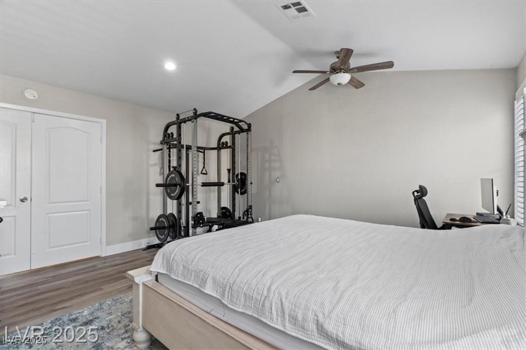 9416 Rolling Ridge Lane Las Vegas, NV 89134 - Photo 22 of 34 Bedroom featuring wood finished floors, vaulted ceiling, a ceiling fan, and recessed lighting