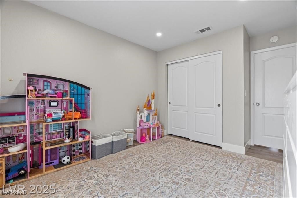 9416 Rolling Ridge Lane Las Vegas, NV 89134 - Photo 29 of 34 Playroom with recessed lighting and wood finished floors
