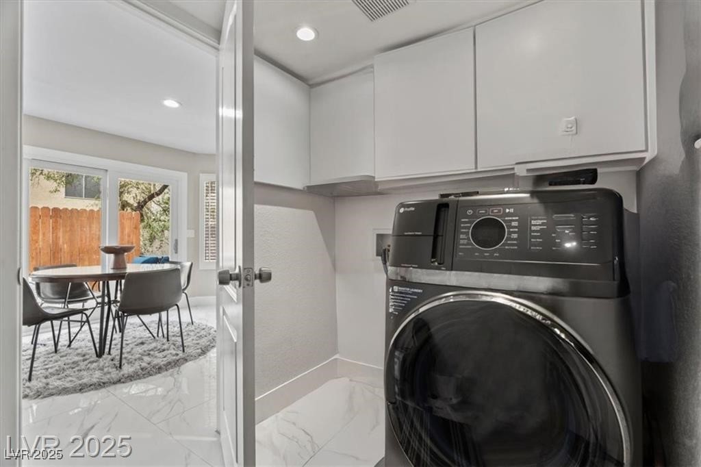 9416 Rolling Ridge Lane Las Vegas, NV 89134 - Photo 30 of 34 Laundry area with washer / dryer, marble finish flooring, recessed lighting, and cabinet space
