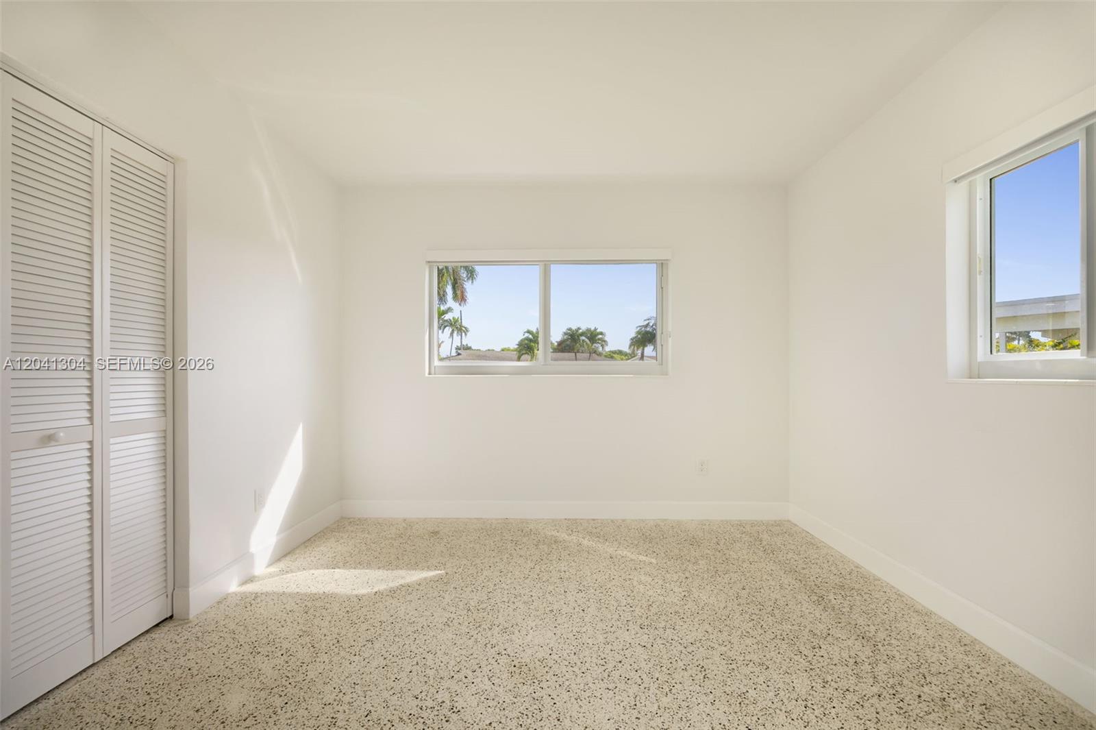 10340 Southwest 157th Street Miami, FL 33157 - Photo 16 of 24 Bedroom – Well-proportioned bedroom with abundant natural light and a clean, modern aesthetic. Flexible layout accommodates a variety of furniture arrangements.