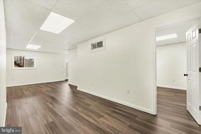 an empty room with wooden floor