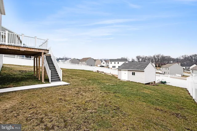 a view of residential houses with ocean view