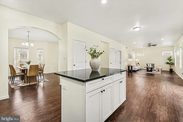 a kitchen with sink and stove top oven