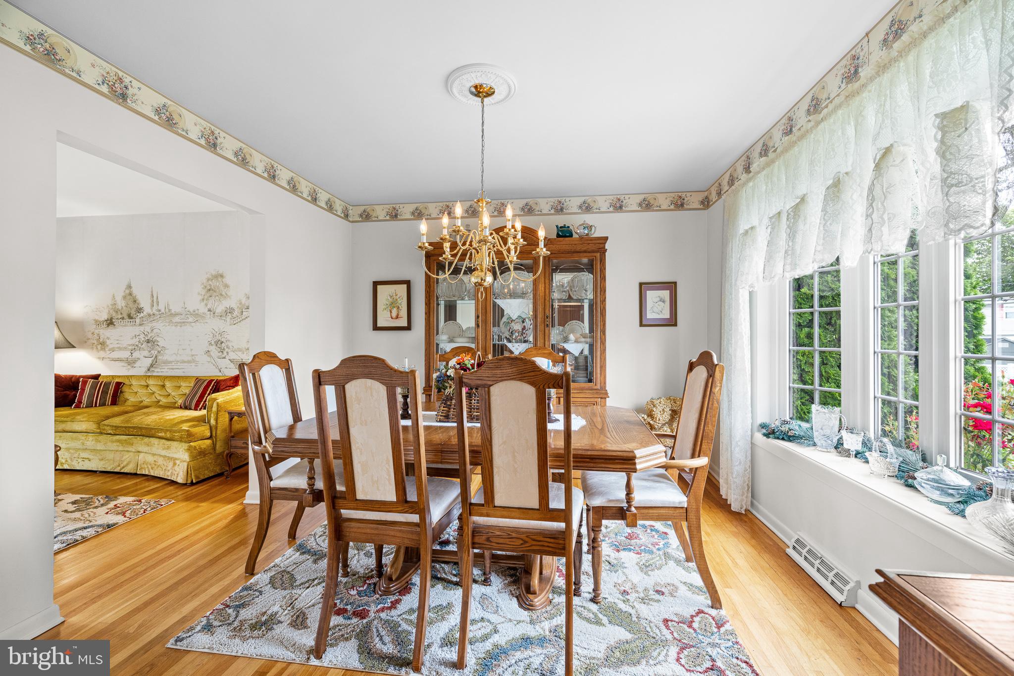 18 Whitfield Road Newark, DE 19711 - Photo 20 of 27 a view of a dining room with furniture a chandelier and wooden floor