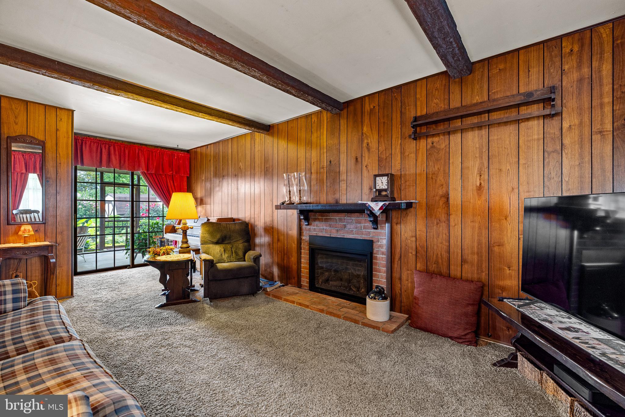 18 Whitfield Road Newark, DE 19711 - Photo 22 of 27 a living room with furniture and a fireplace