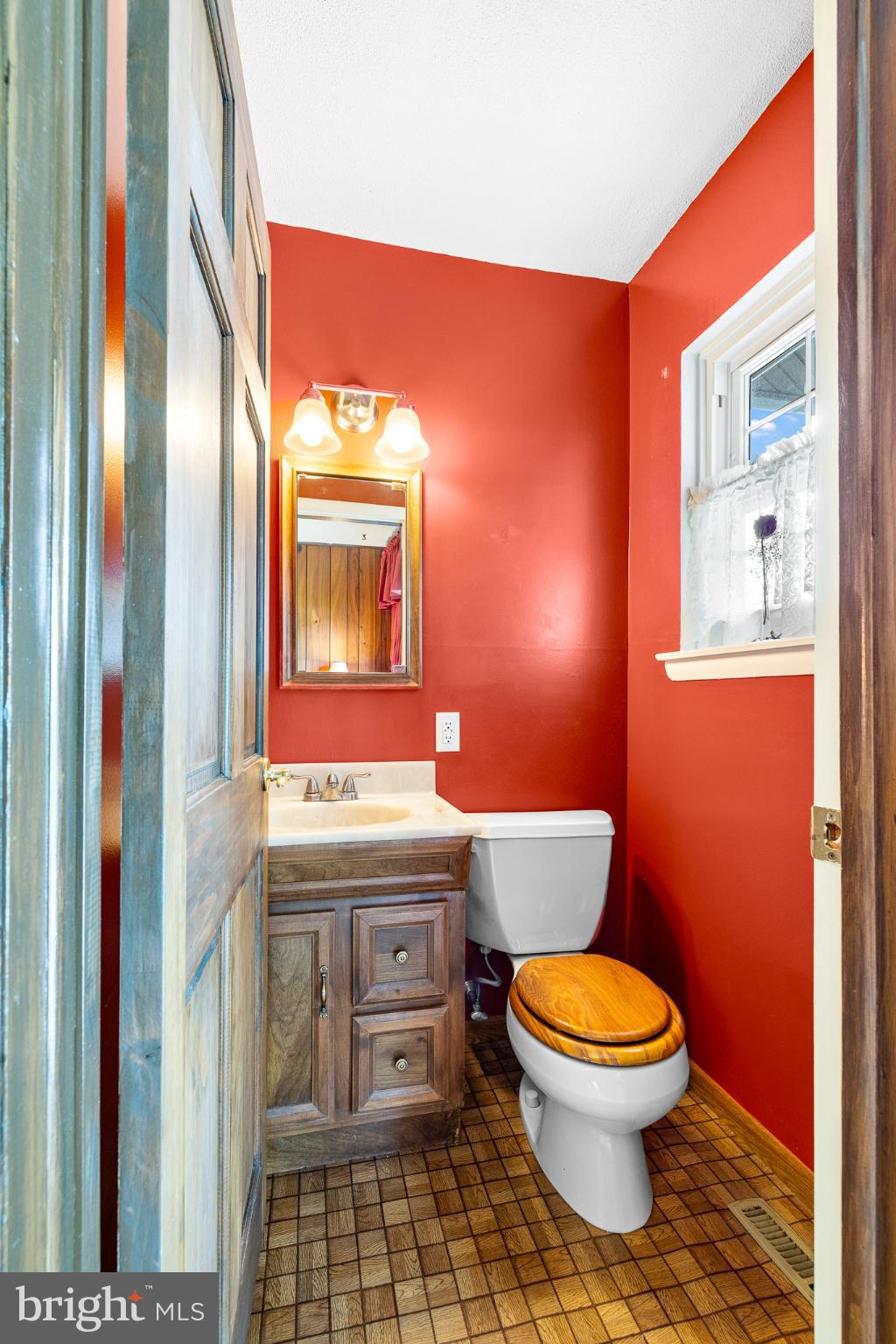 18 Whitfield Road Newark, DE 19711 - Photo 23 of 27 a bathroom with a toilet a sink and mirror
