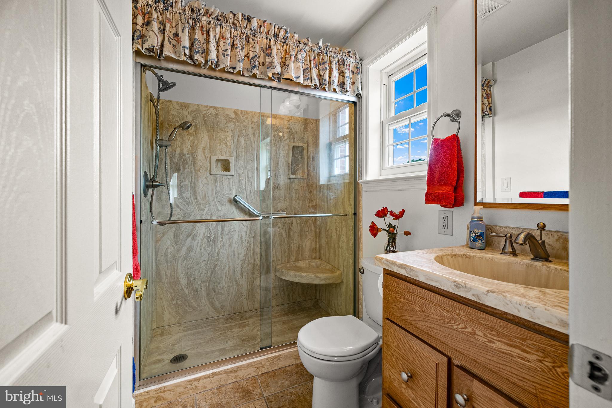 18 Whitfield Road Newark, DE 19711 - Photo 24 of 27 a bathroom with a sink toilet and shower