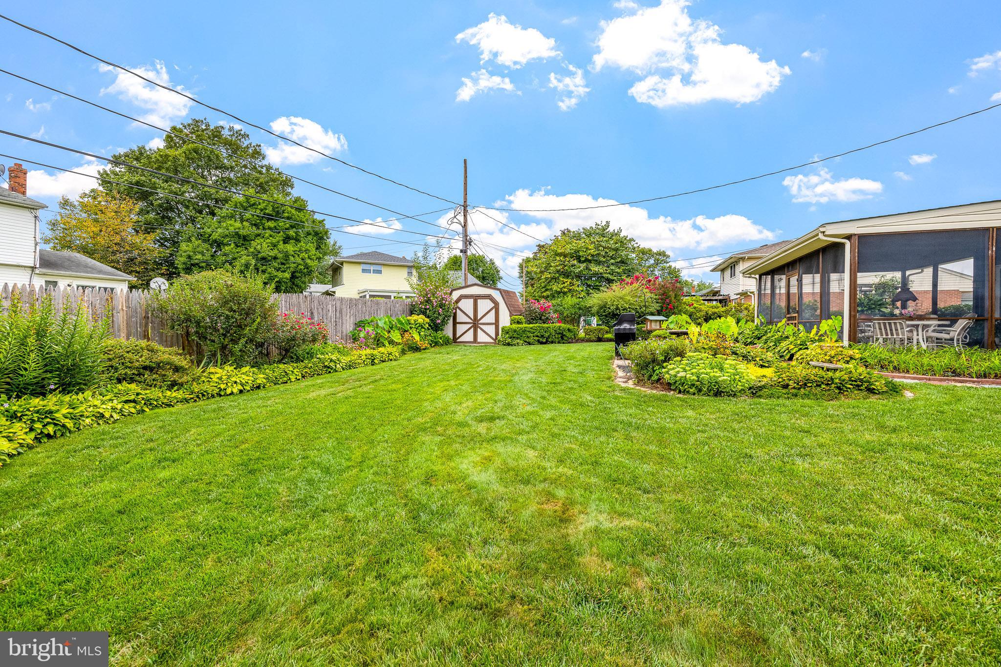 18 Whitfield Road Newark, DE 19711 - Photo 6 of 27 a view of a house with a big yard and potted plants