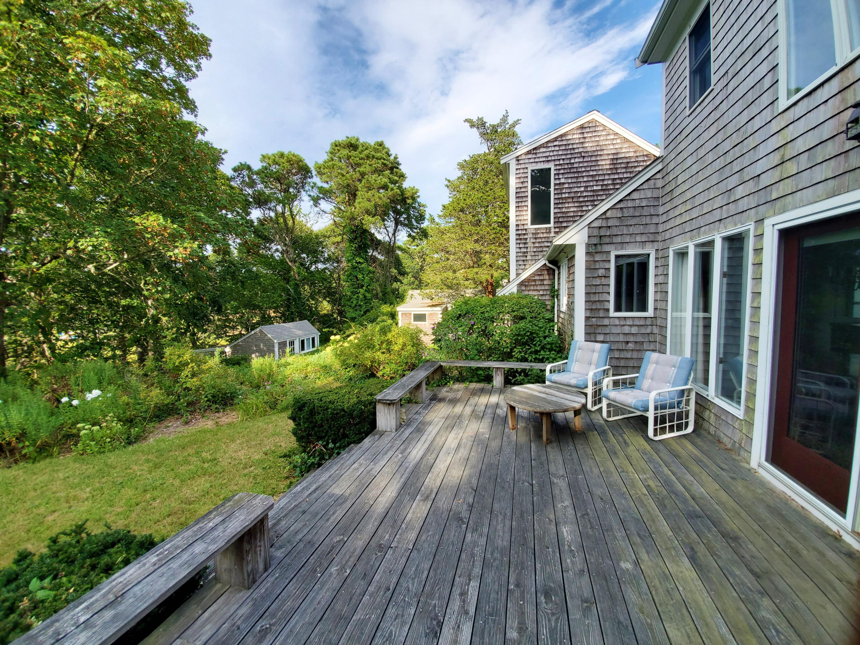 22 Jack Knife Point Road Orleans, MA 02653 - Photo 11 of 37 a view of a house with patio outdoor seating