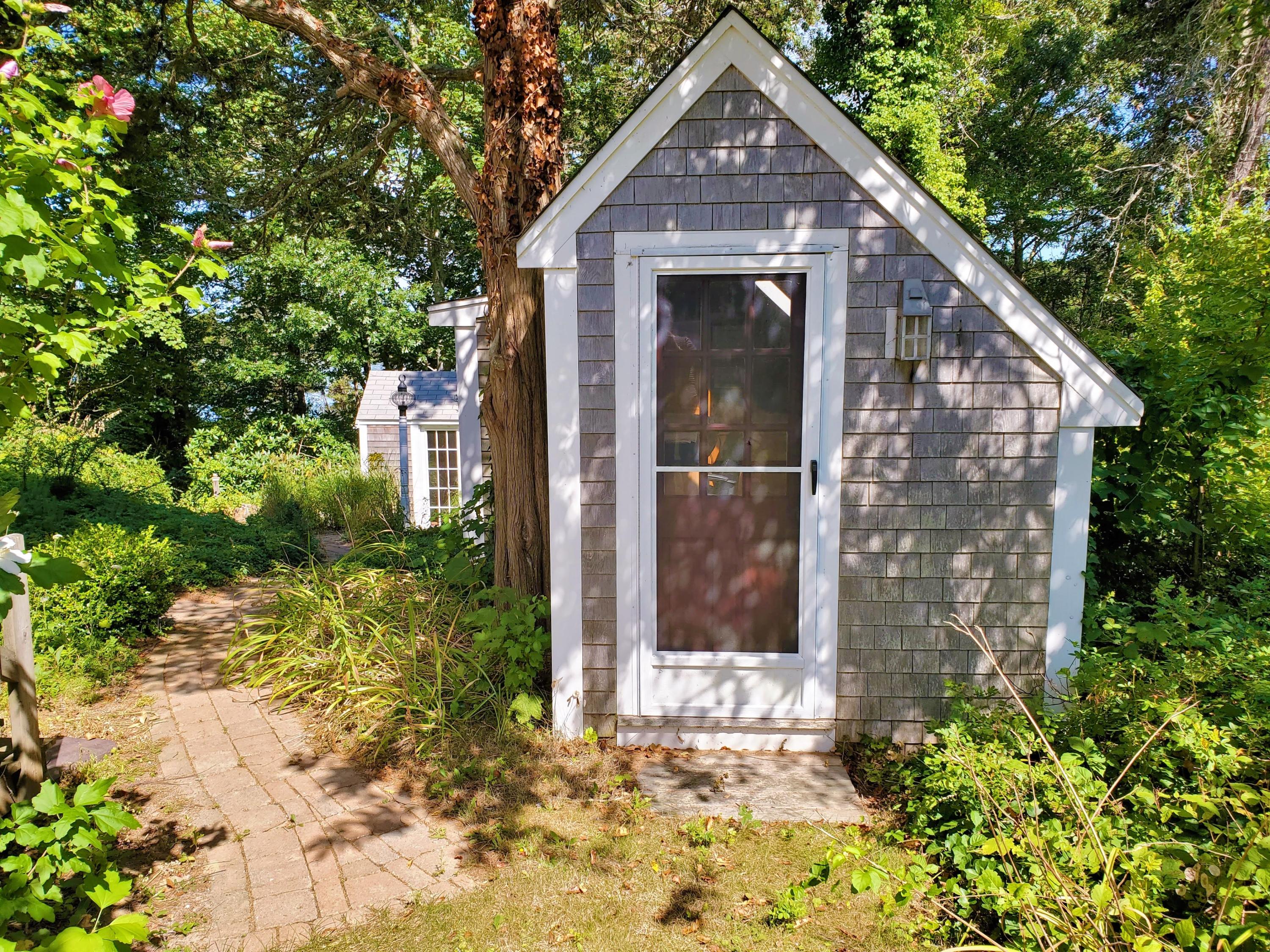 22 Jack Knife Point Road Orleans, MA 02653 - Photo 13 of 37 a front view of a house with a yard