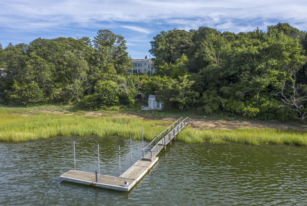 22 Jack Knife Point Road Orleans, MA 02653 - Photo 20 of 37 a view of a lake with a yard
